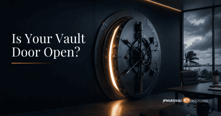 Large bank vault door partially open in a modern office with storm clouds visible outside, symbolizing hidden cybersecurity risks during hurricane season.